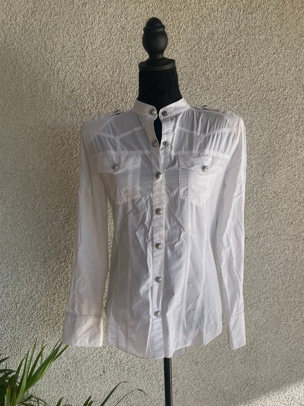 White shirt with silver buttons